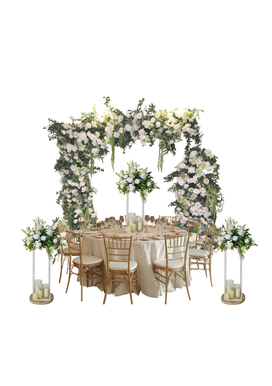 Floral Gate Grace with Matching Centrepieces Elegant wedding setup featuring a floral arch, round table, and decorative centrepieces.