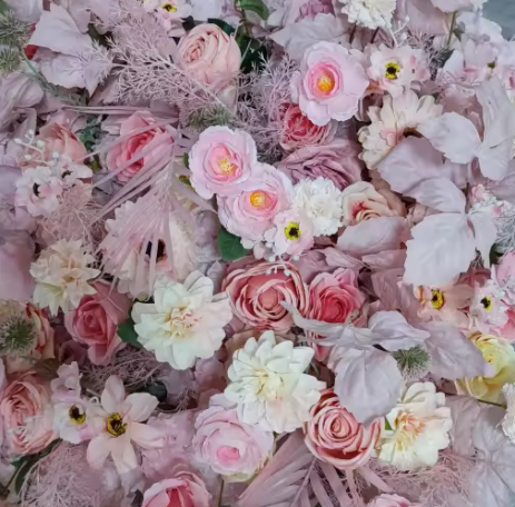 A vibrant arrangement of pink and white flowers with delicate green accents.